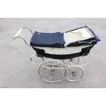 A Wilson pram, mid 20th century, royal blue and white with blue canopy and cream interior,