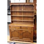 A 20th century oak dresser and rack