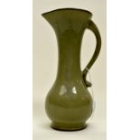 A Studio Pottery jug, green,