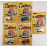 Tyco electric trucking series slot cars including Dodge Police, Smiths Tyres, Ambulance,