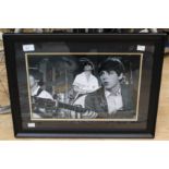 Large black and white photo of the Beatles,