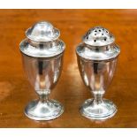 A pair of George III silver condiments, pepper pot and salt or spice shaker,