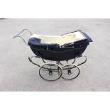 A Silver Cross pram, mid 20th century, royal blue with blue canopy and cream interior,