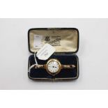 A 9ct gold cased ladies expandable wristwatch, round white enamel dial, numbers,
