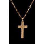 A Victorian 9ct gold cross and chain, the cross with floral decoration.