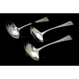 A matched set of three Old English Pattern silver sauce ladles, each handle engraved with a crest,