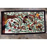 A South American wall hanging of tropical birds