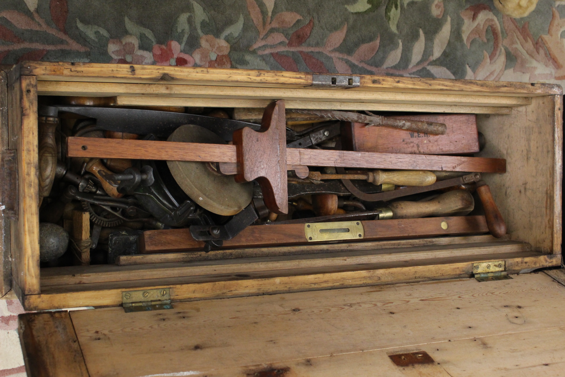 A chest of assorted interesting tools, grinder, large screwdrivers, a steel Barb, hand forged,