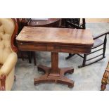 A 19th century mahogany fold over and twist top card table, blue interior.