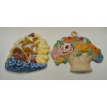 Two Beswick hand painted wall plaques, numbered 556 and 263, one depicting a basket of flowers,