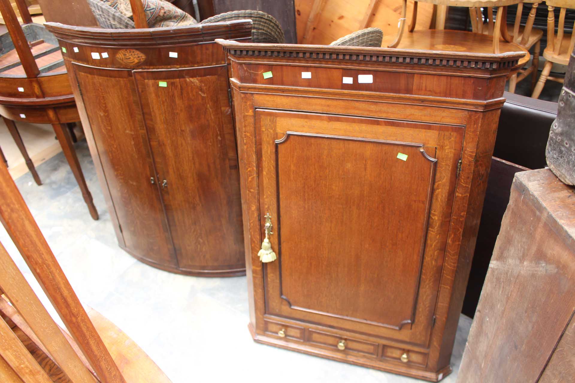 Two mahogany George III corner wall hanging cupboards,