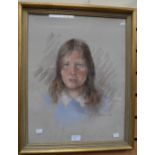 A head and shoulders portrait in chalk signed Rita Busby 1975