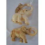 Two Japanese Netsuke ivory Mammoth and elephant with a monkey,