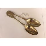 A matched pair of early Victorian silver table spoons, hallmarked for London 1840 and 1860,