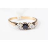 A 9ct gold diamond and sapphire three-stone ring,