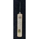 A signed cricket bat bearing the signatures of: Eric Clapton, George Harrison, Jeff Lynne,