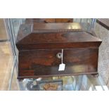 An early Victorian rosewood sarcophagus tea caddy,