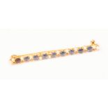 A pearl and sapphire bar brooch, length approx 43 mm, total gross weight approx 2.