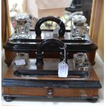 A pair of early 20th Century desk tidy accessories walnut veneer and glass ink wells