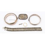 A silver vesta case, two silver bracelets,