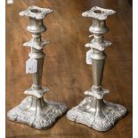 A pair of Victorian style silver plated candlesticks, cast decoration,