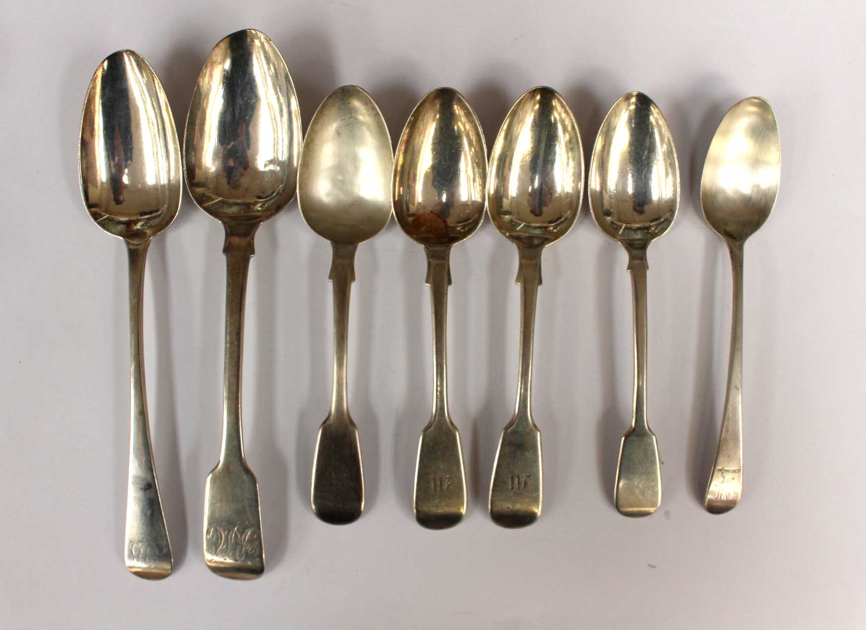 A collection of assorted silver spoons,