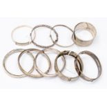 Nine assorted silver and white metal bangles