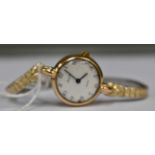 An Avia 9ct gold wristwatch, white dial chip to dial, with expanding plated bracelet,