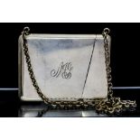 A 20th Century silver-plate card case on suspension chain,