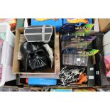 A collection of Star Wars toys in two boxes