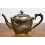 An Edwardian silver half reeded teapot, Chester 1909, 18.