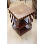 An Edwardian standing bookcase in mahogany crossbanded.