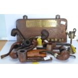 A selection of nine pipes and a walnut cigar case,