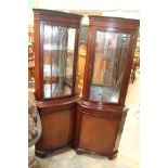 A pair of reproduction corner cabinets