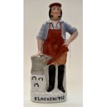 A 19th Century Staffordshire figure of a blacksmith,