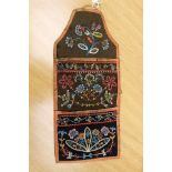 A Victorian handkerchief coser? embellished with a colourful design of flowers and leaves,