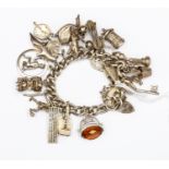 A silver charm bracelet with charms