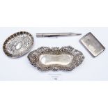 A collection of silver comprising two decorated silver pin dishes,
