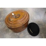 A late 19th Century tin hat box complete with a small bowler hat, by Moores, The Atlas Brand,