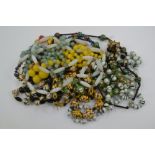 A quantity of glass bead necklaces