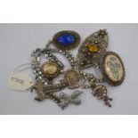 A collection of assorted paste costume jewellery, mostly brooches, including some silver pieces,