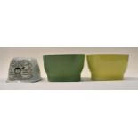 Three various jelly moulds, comprising one in green,
