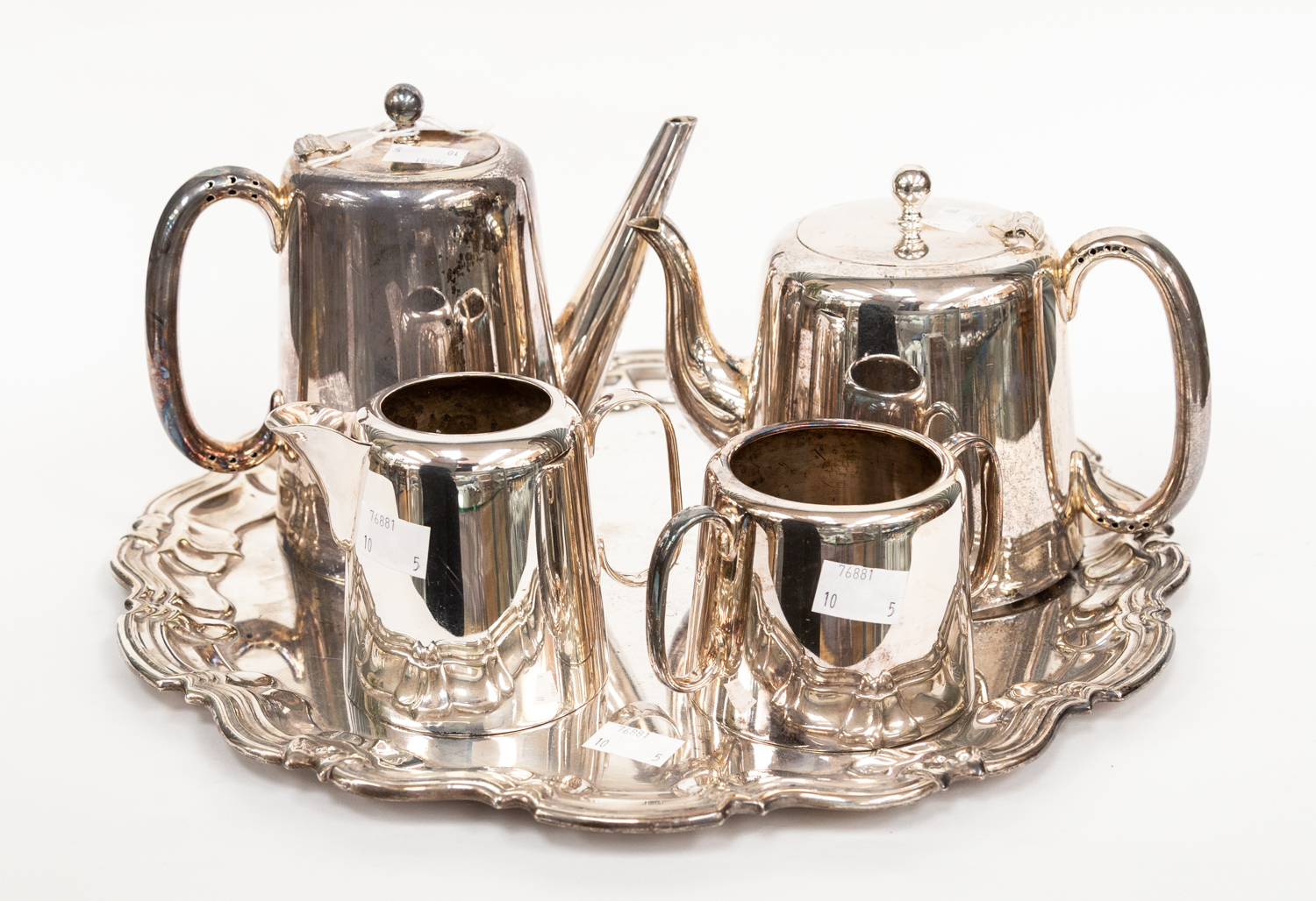 A four piece silver plate EPNS strong soldered tea set with a circular tray,