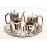 A four piece silver plate EPNS strong soldered tea set with a circular tray,