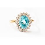 An 18ct gold blue zircon and diamond cluster ring, ring size I, total gross weight approx 4gms,