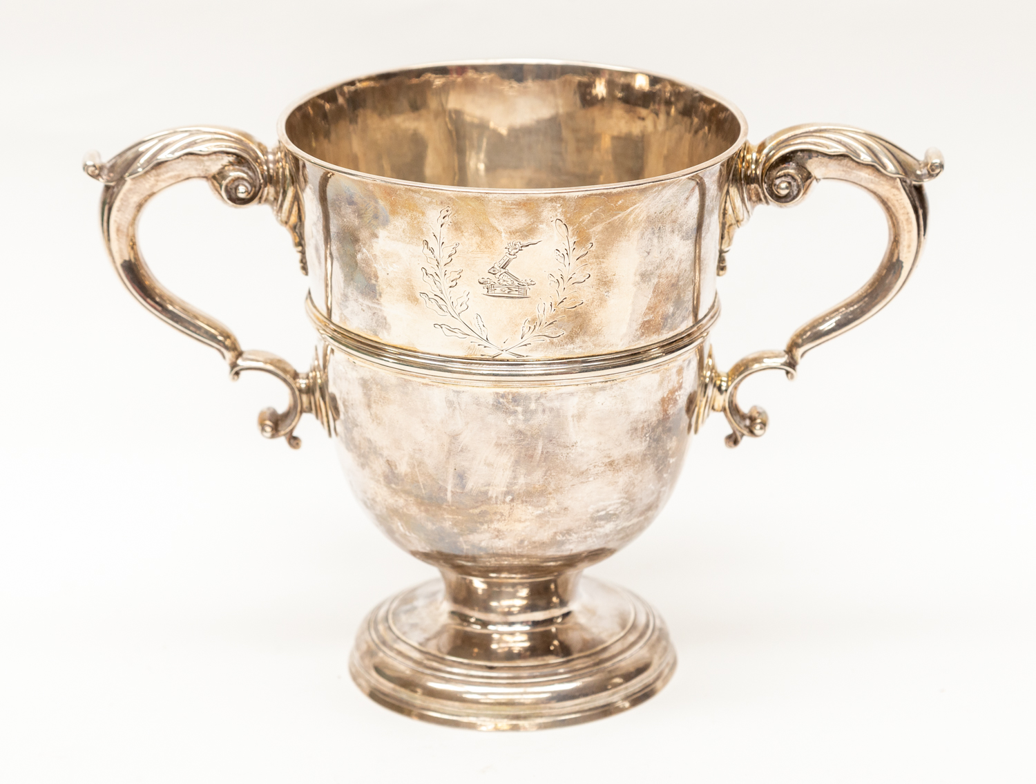 IRISH INTEREST: A George II Irish silver twin handled loving cup,