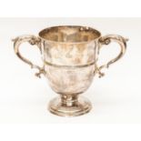 IRISH INTEREST: A George II Irish silver twin handled loving cup,