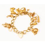 A 9ct gold charm bracelet, with various 9ct gold and unmarked yellow charms including a duck,