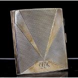 An Art Deco silver cigarette case, the cover and base with engine turned decoration,
