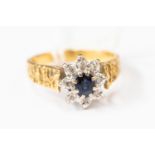 A sapphire and diamond set dress ring, circa 1970's textured shank, size N,